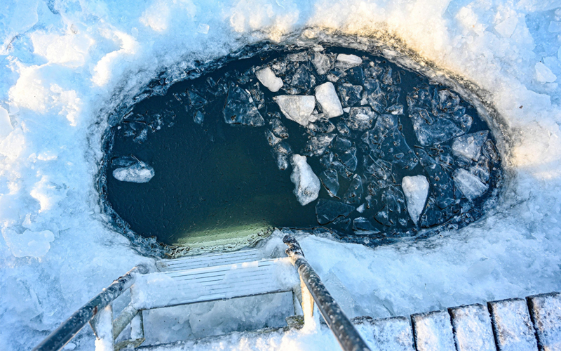 A hole cut into the ice