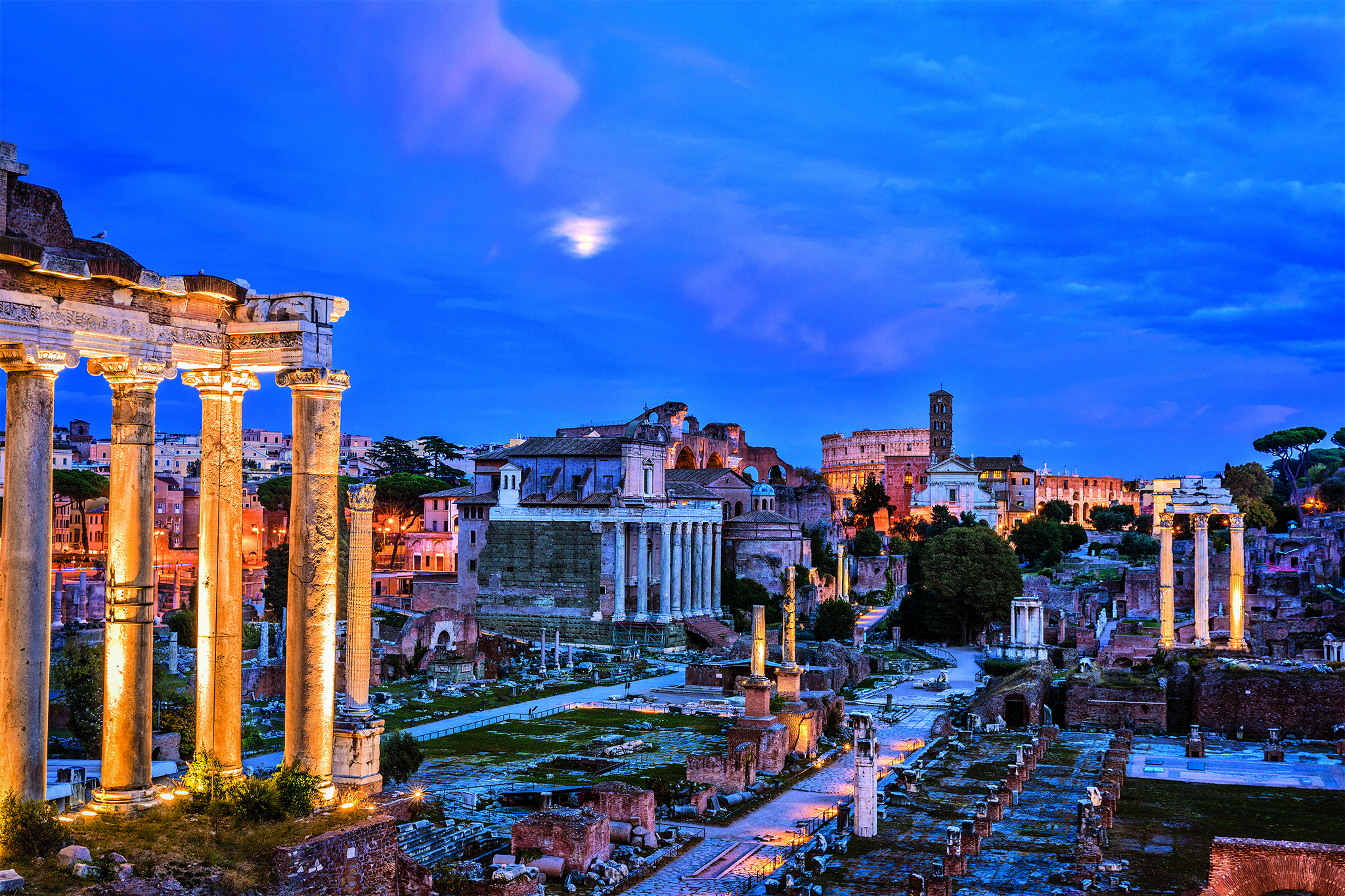 A hub of temples and public buildings, this site was the city’s political center throughout the history of Rome. In the foreground are the columns of the Temple of Saturn, which housed the public treasury. 