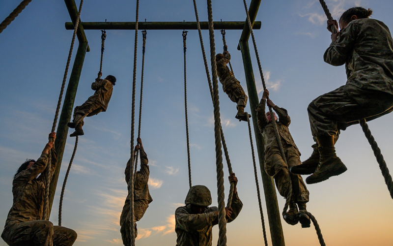 Marine recruits climb ropes