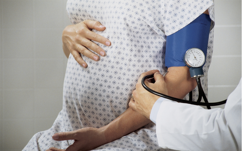 A pregnant person at the doctor’s office